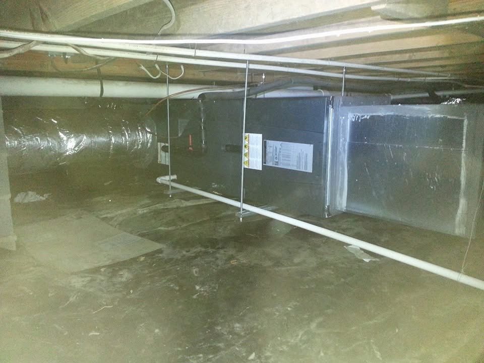 Air handler and insulated ductwork installed in a residential crawlspace