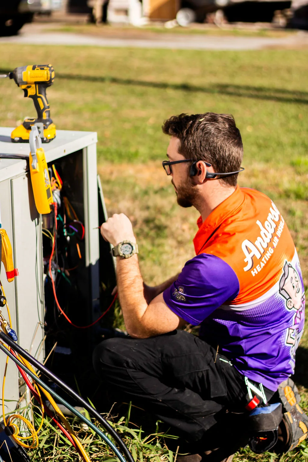 Anderson technician testing the wiring of an outdoor AC unit