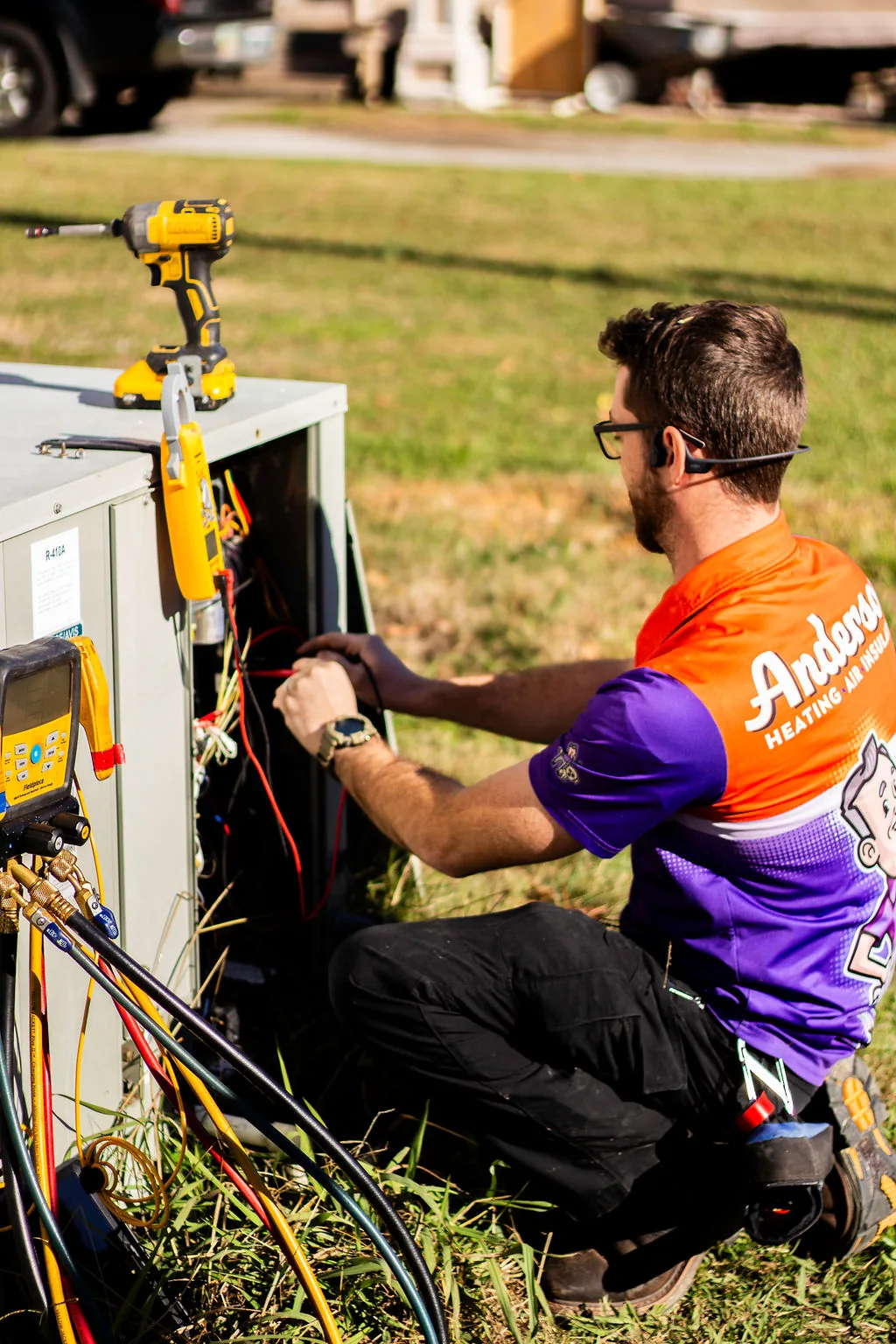 Anderson technician working on an outdoor HVAC unit