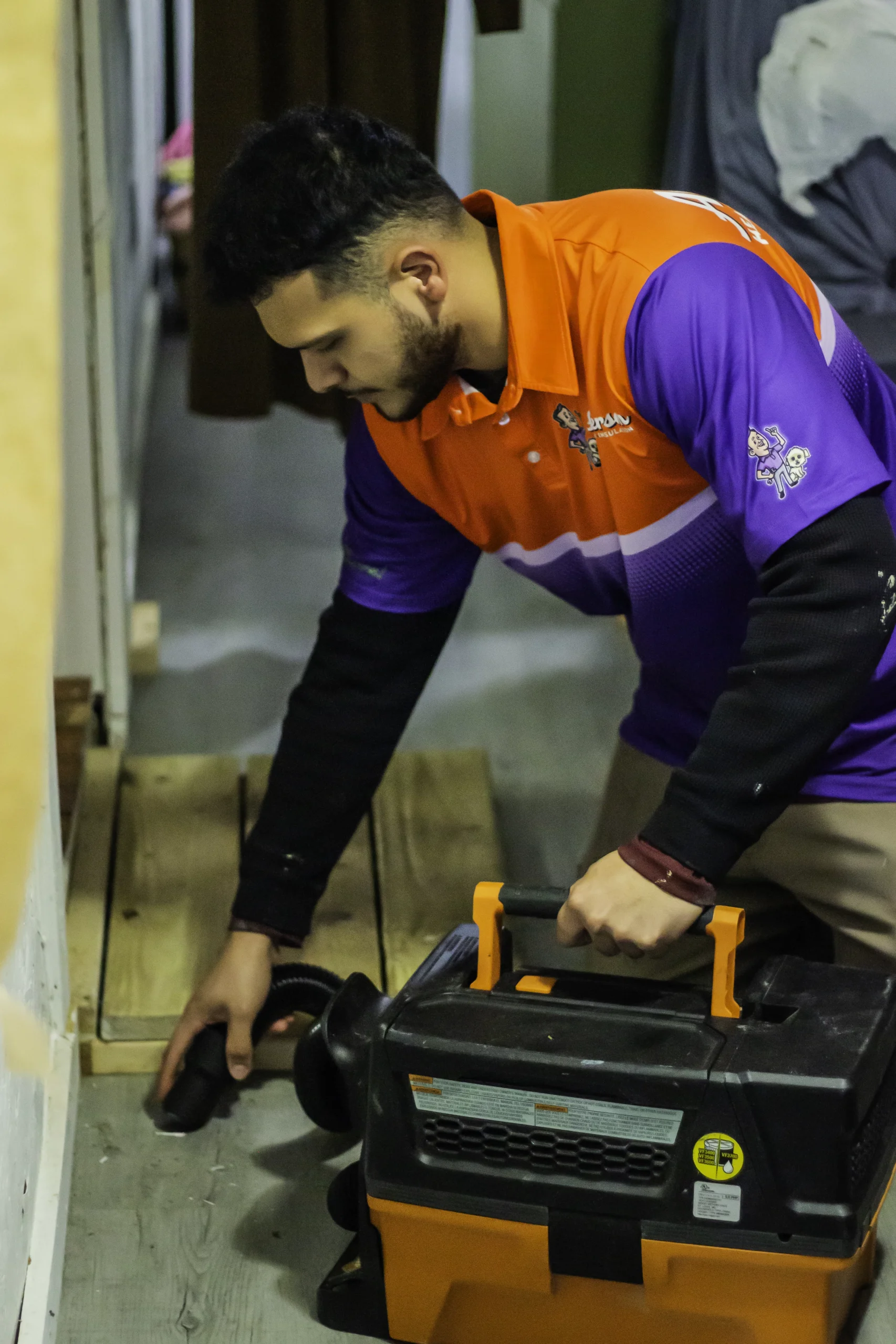 Technician performing professional air sealing service in Calhoun GA to reduce drafts and improve home energy efficiency.